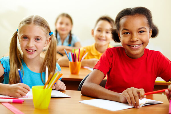 10446081 - portrait of lovely girls looking at camera at lesson
